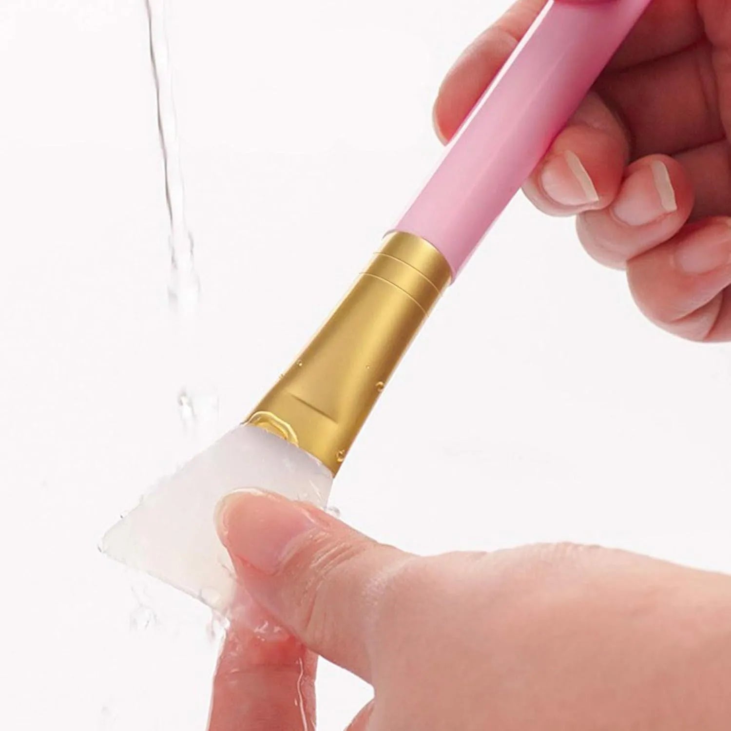 Soft silicone face mask spatula applicator in a choice of six colours on a clean background.