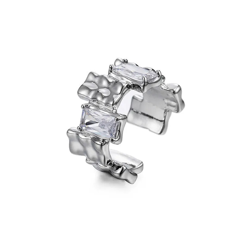 Open geometric zircon ring with three-dimensional decoration in silver colour