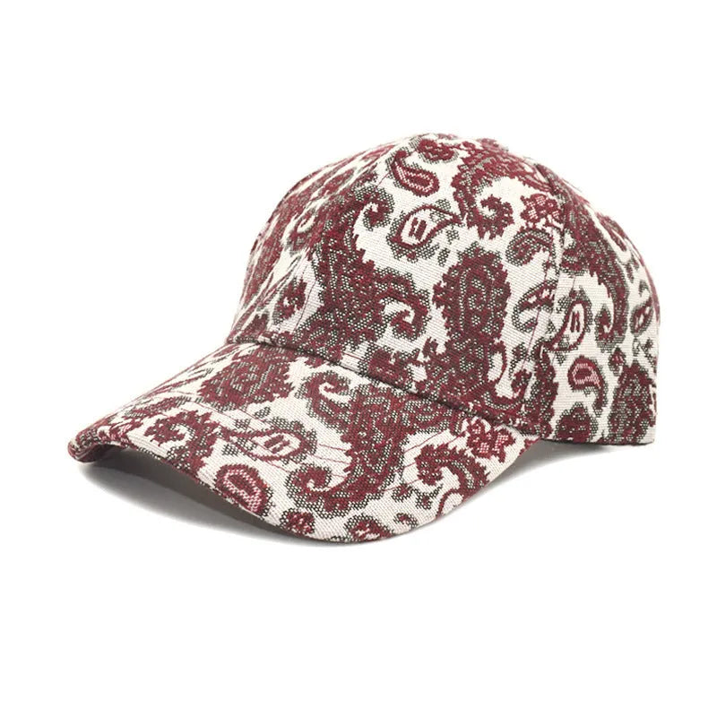 Blue polyester baseball cap with a white paisley pattern print and a dome crown.