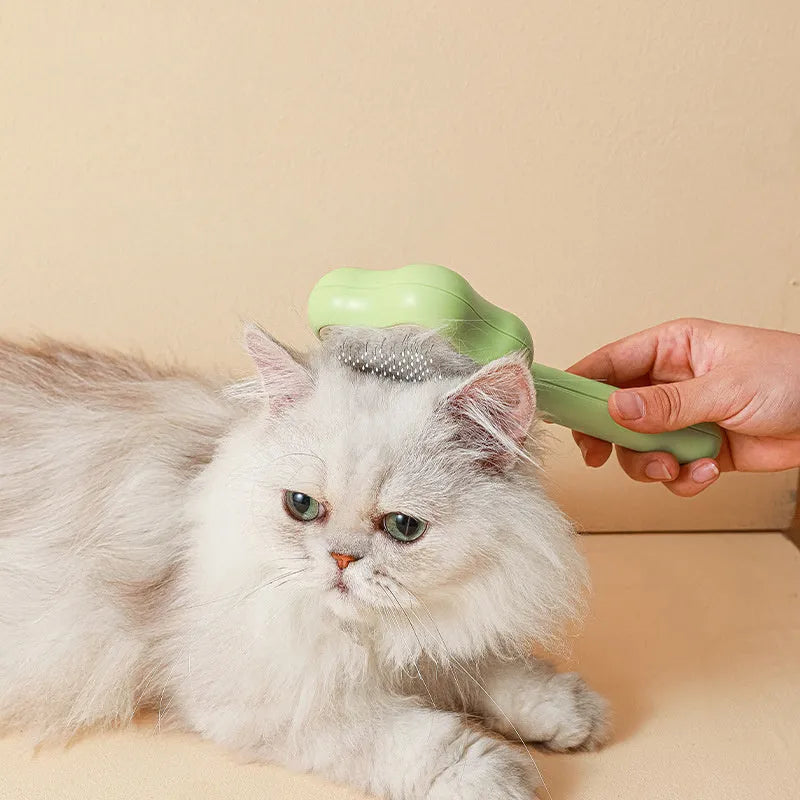 Self-cleaning pet grooming comb with stainless steel needles showing green colour option