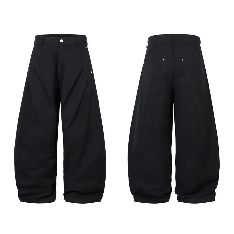 Men's black pleated casual trousers with a loose wide-leg fit and elasticated mid-waist.