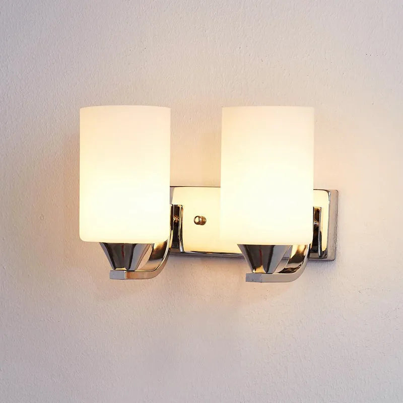 Chrome-finished minimalist glass wall lamp with adjustable dual heads for bedside lighting