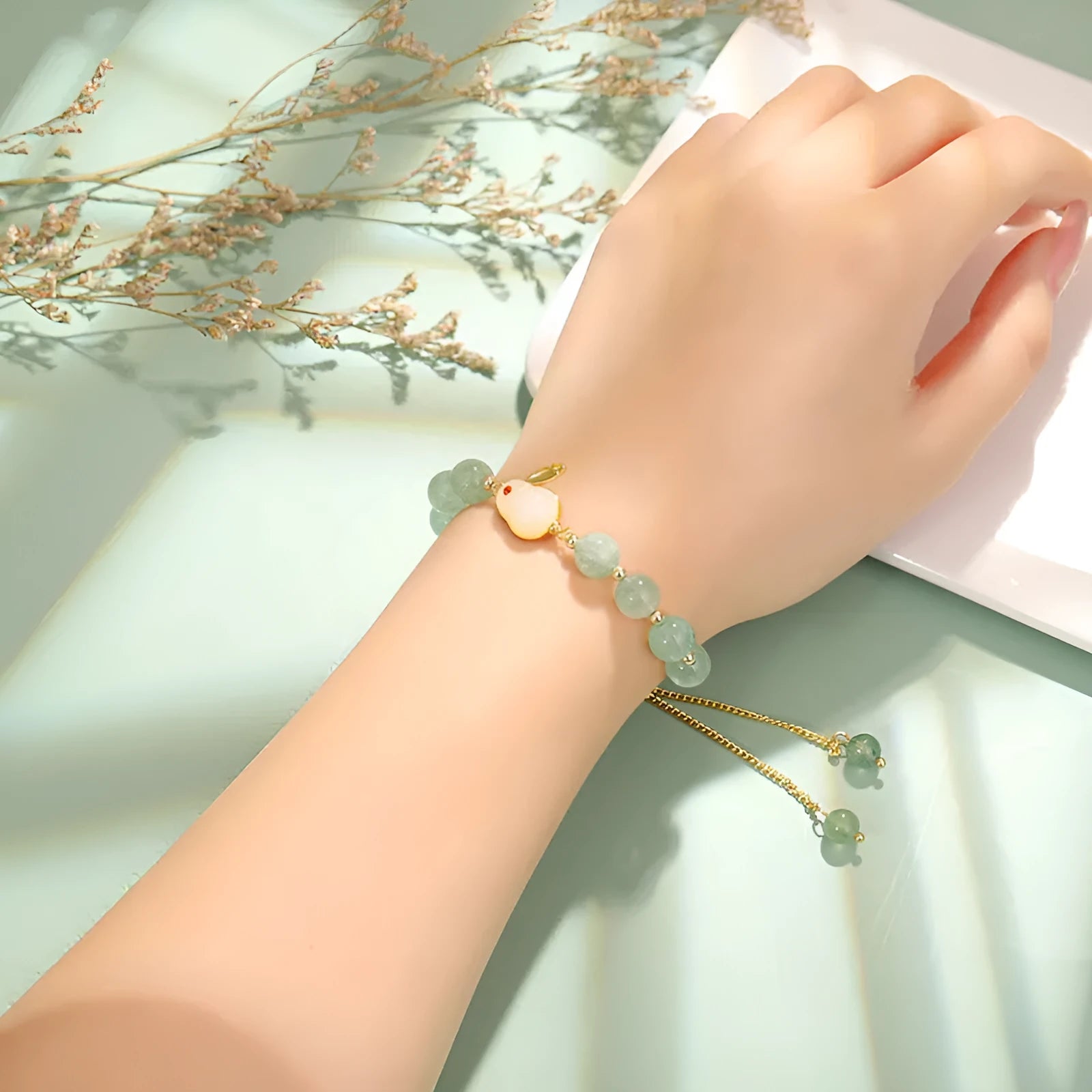Rabbit charm bracelet with green aventurine or strawberry quartz stones on gold-plated chain