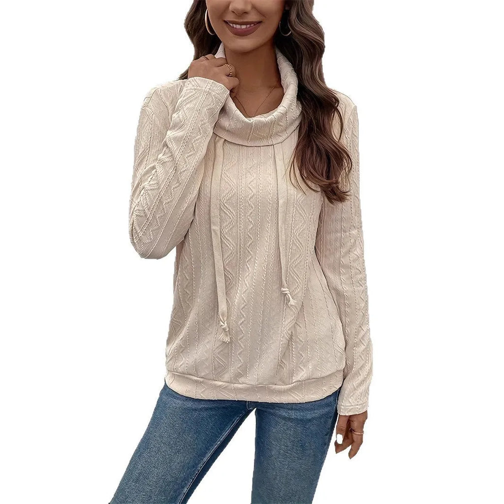 Apricot coloured long sleeve hooded pullover sweater with a drawstring.