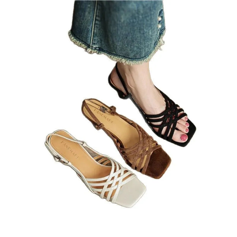 Retro beige high heel sandals with thin cross straps and an ankle buckle on a square toe.