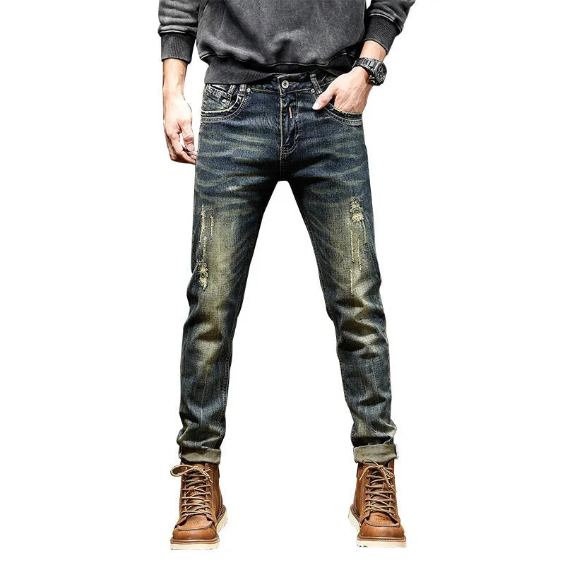 Men's skinny fit retro blue jeans with a high waist and zip fly on a plain background.