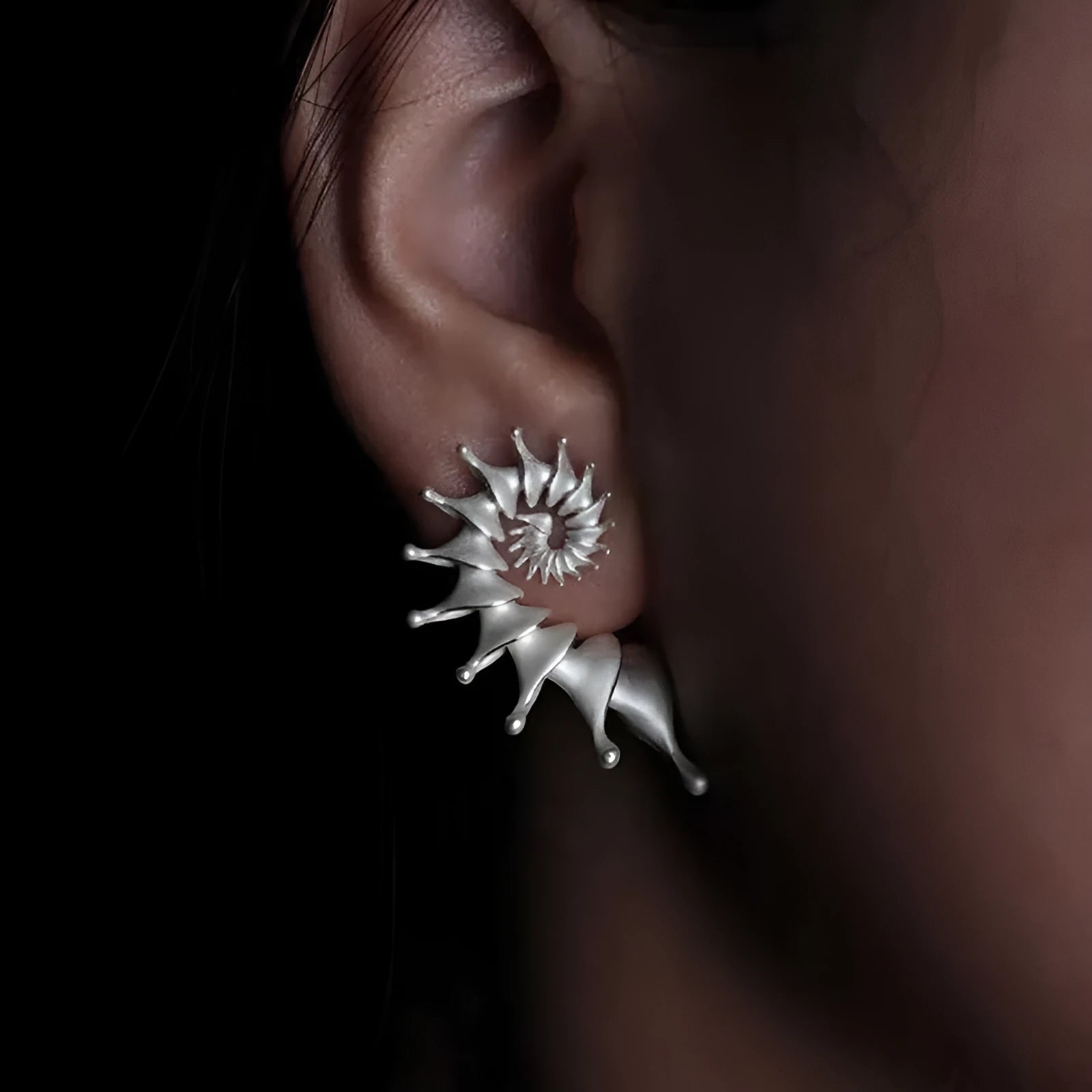 Conch coloured geometric stud earrings with three-dimensional matte finish