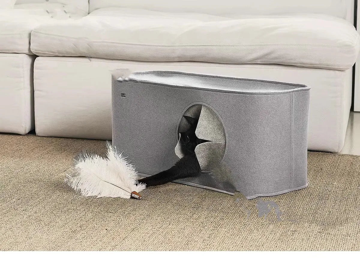 Foldable grey felt cat nest bed shown in a home setting next to a cat.