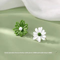 Close-up of colourful alloy flower stud earrings in cartoon style on a white background.