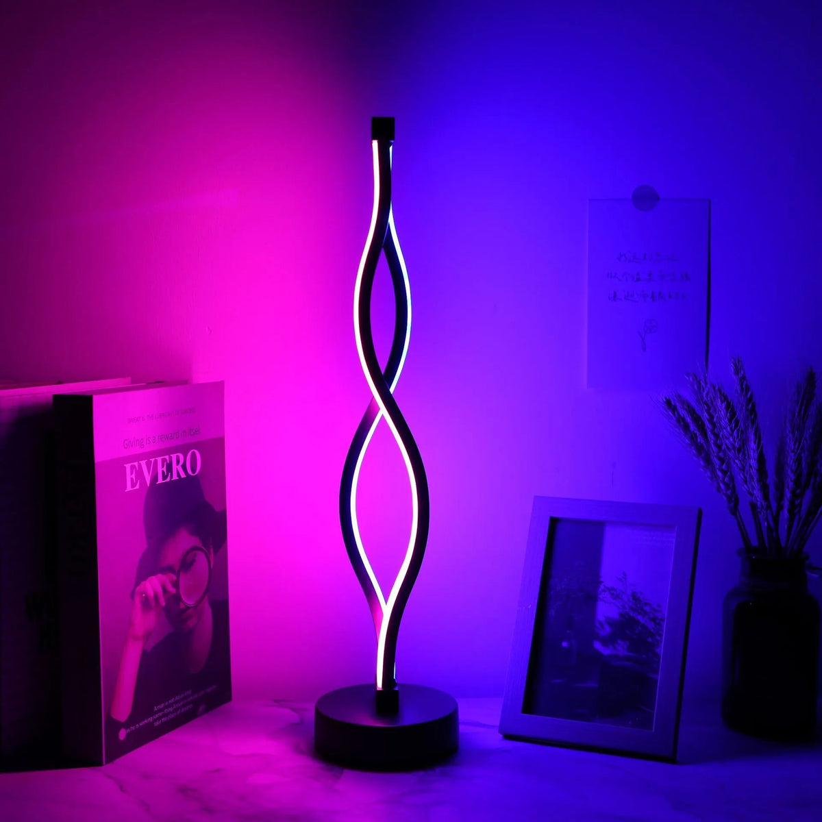 Black aluminum desk lamp with a touch dimming base on a wooden desktop.