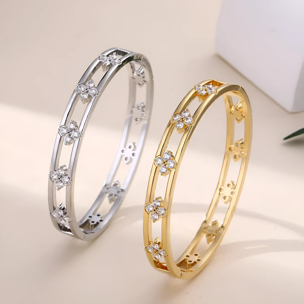 Women's hollow bracelet with four-leaf clover charm and zircon inlay in gold or silver colour