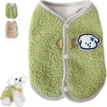 Green thickened coral fleece dog vest with a metal leash ring on the back, laid flat.