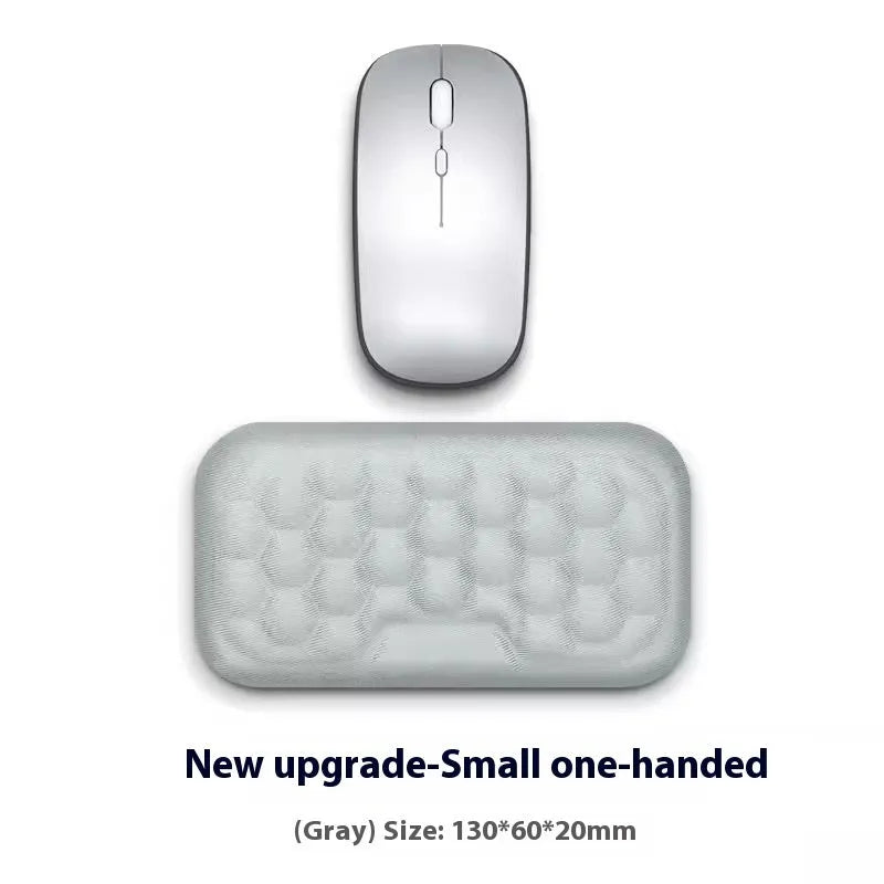 Memory foam mouse wrist pad with silicone bottom in black cloth cover on computer desk