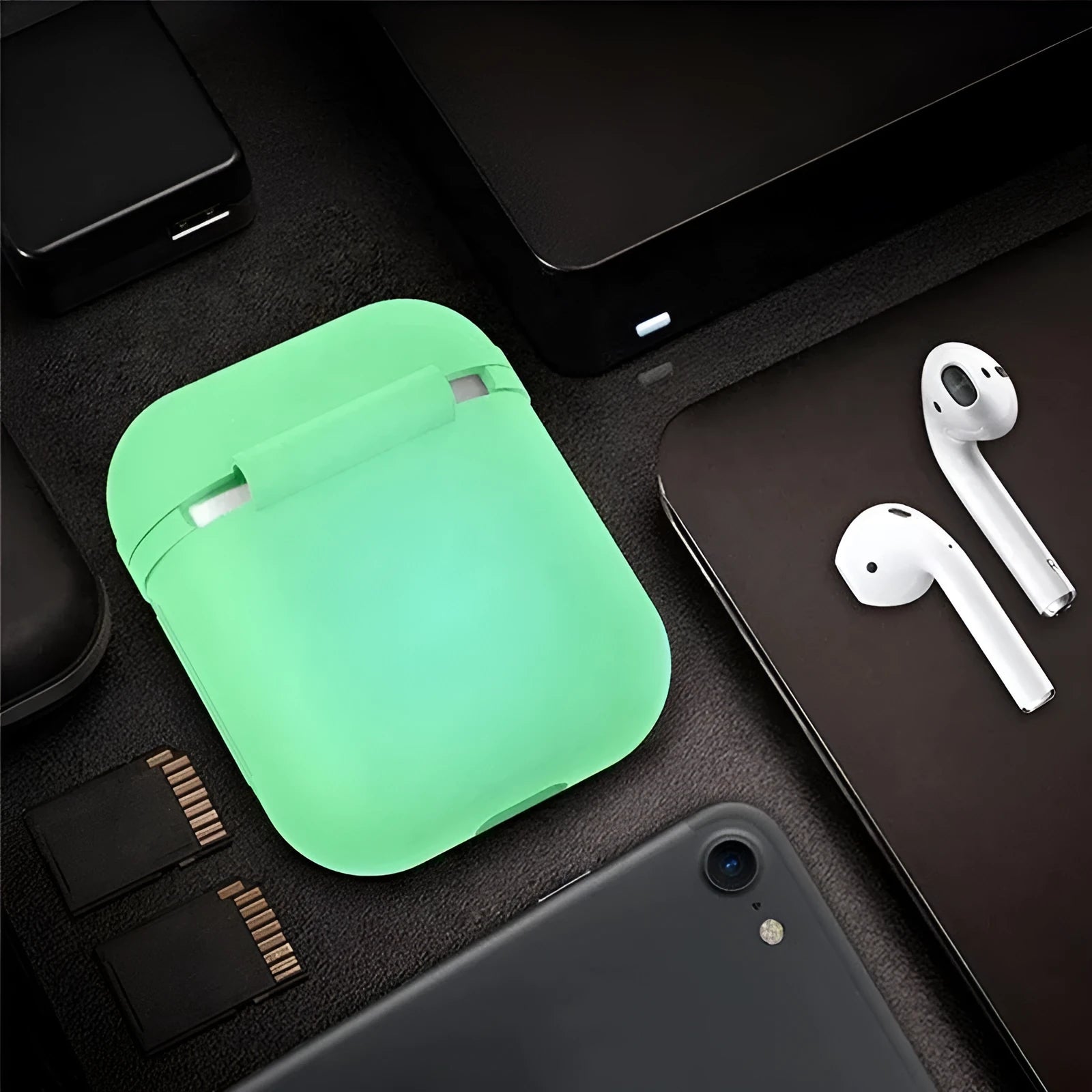 Luminous solid colour silicone flip cover case for Apple AirPods wireless earphones.