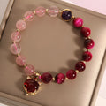Simple women's bracelet with a strawberry crystal on an 18cm elastic rope band.