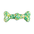 Natural rubber dog chew toy in camouflage pattern with bone shape, shown in green, white and yellow colours