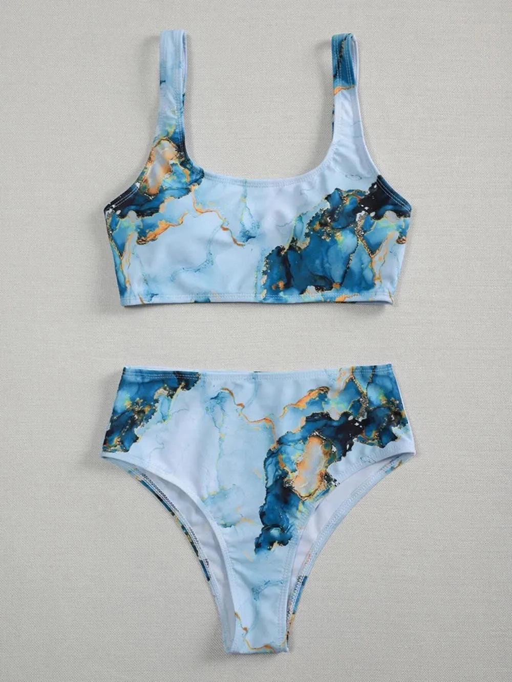 Women's high-waist bikini set with marble tie-dye print and U-neck top.