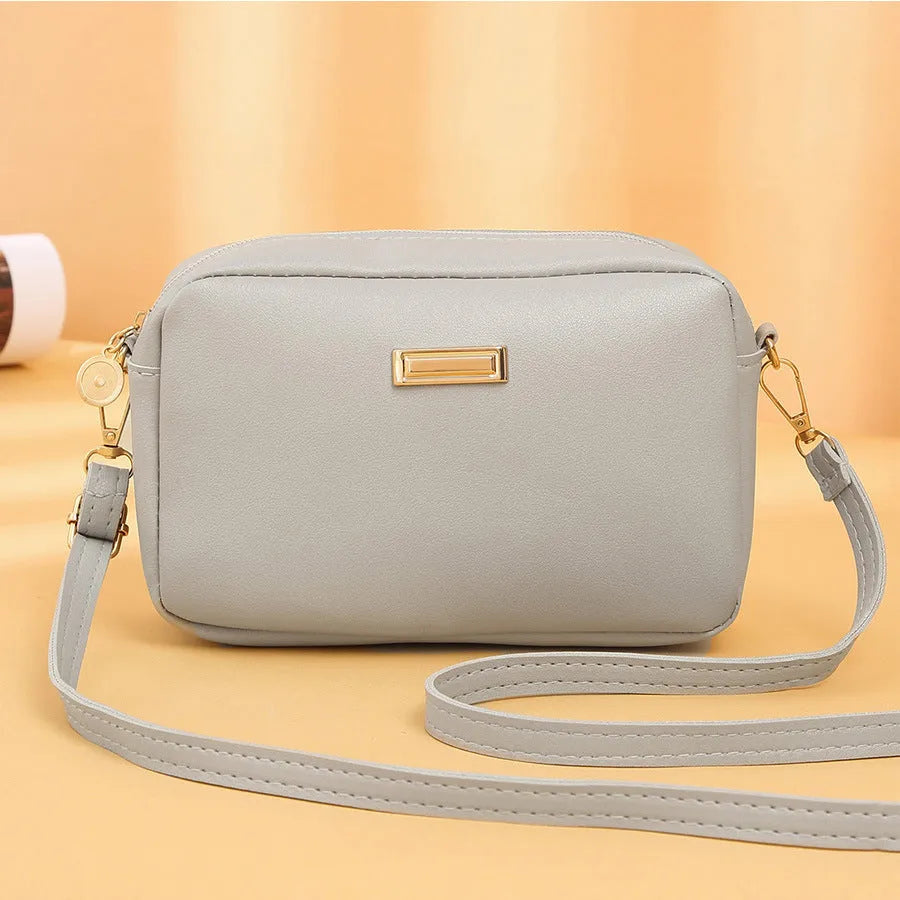 Solid colour women's PU shoulder bag with three-dimensional pockets in horizontal square shape