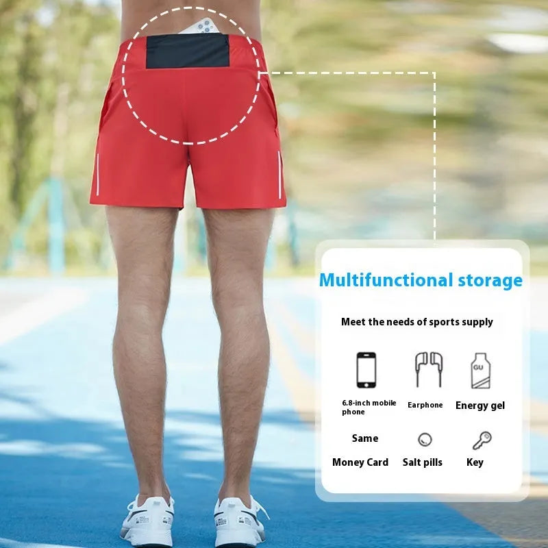 Men's red off-road running shorts with high waist and loose fit on a running trail.