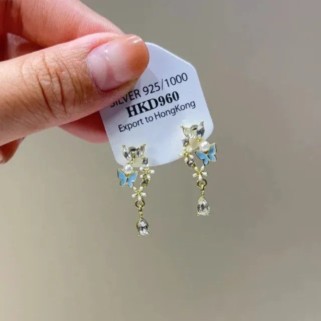 Geometric heart-shaped women's ear clip with star rhinestone tassel detail in electroplated alloy