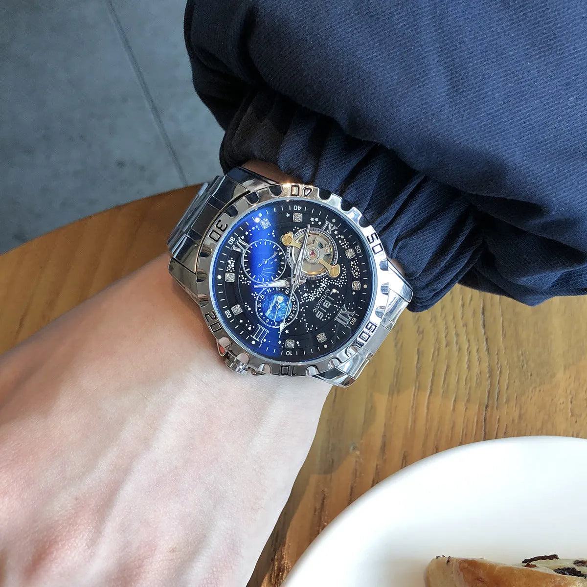Men's silver case automatic mechanical watch with luminous hands, waterproof starry dial, and genuine leather strap