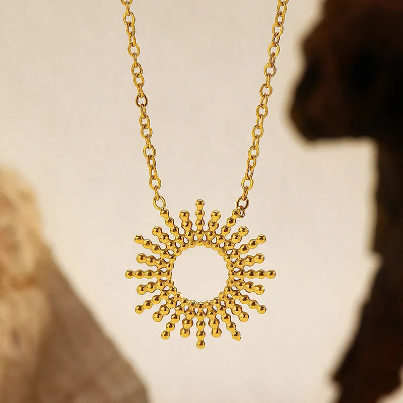Sunflower pendant necklace and bracelet set in gold-plated stainless steel with geometric chain links