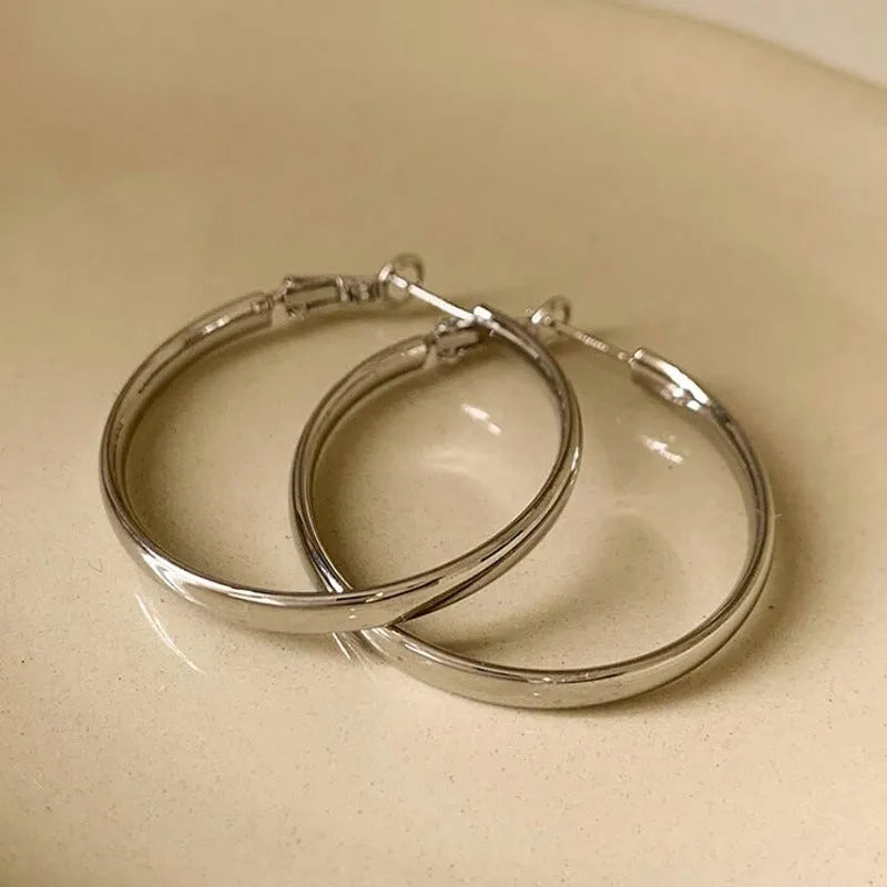 Gold and silver metal circle hoop earrings with 40mm diameter electroplated copper construction