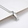 Silver curved peach heart pendant on a stainless steel necklace chain