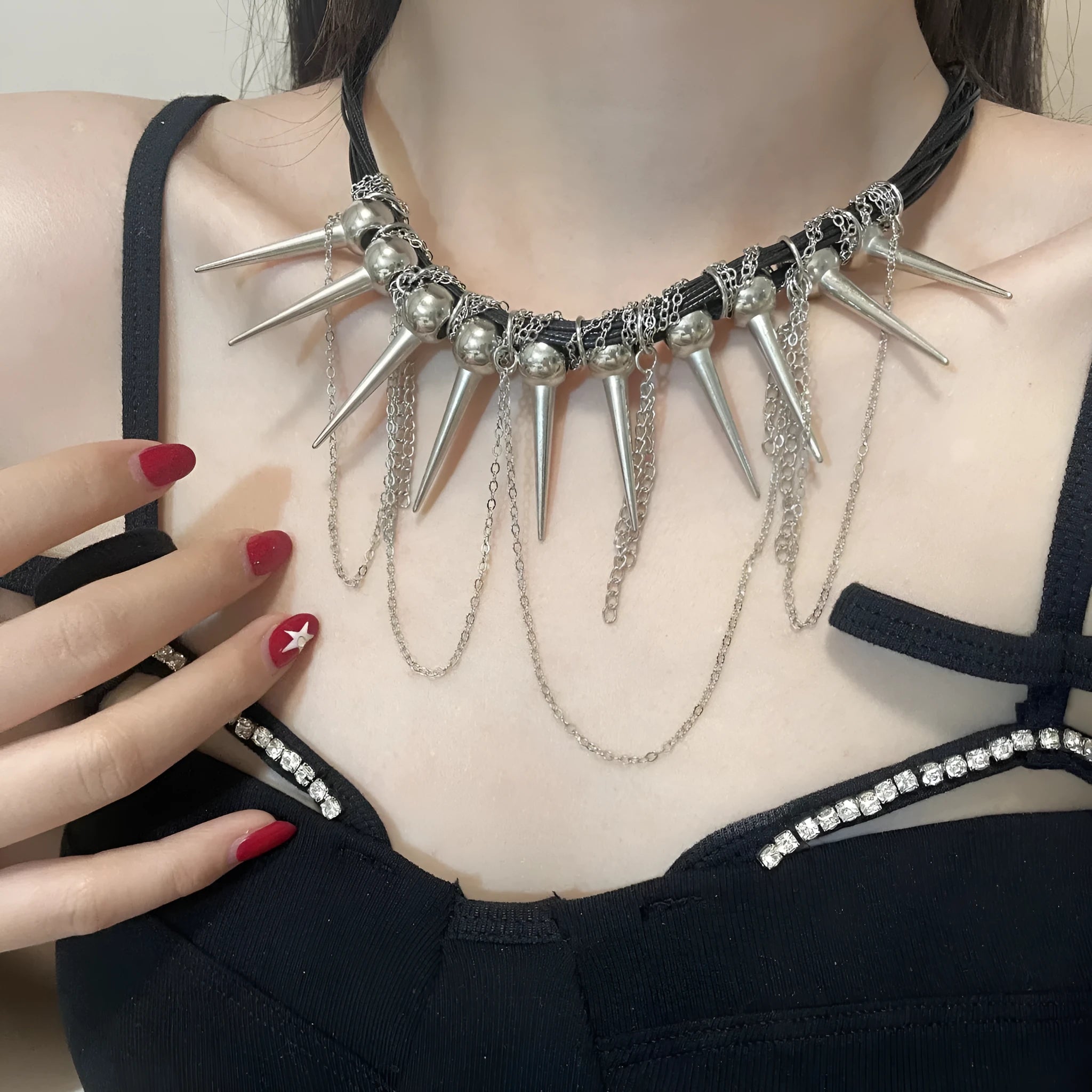 Women's leather necklace with winding tassel, round beads, and metal rivet details