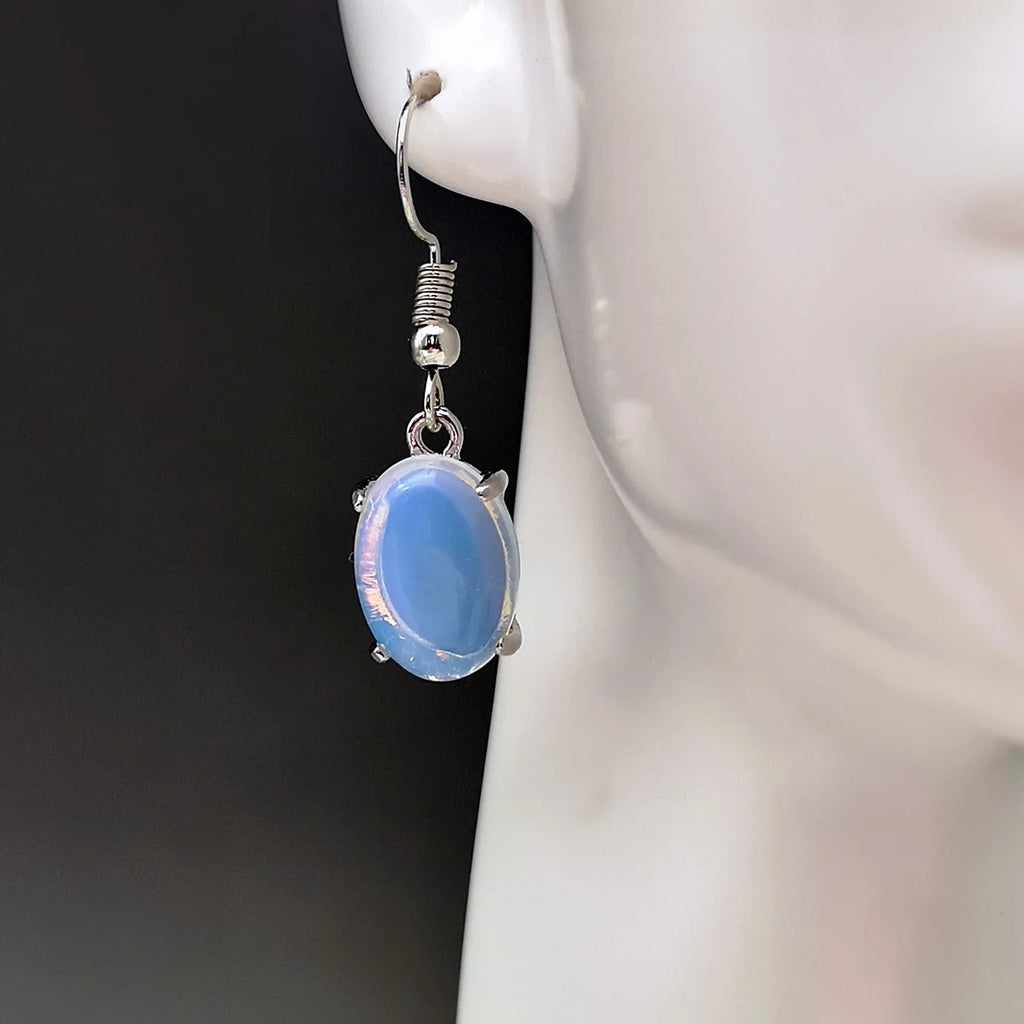 Moonlight opal drop earrings with retro cross design and ellipse detailing