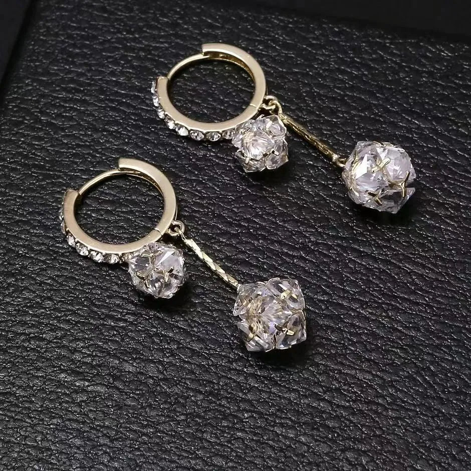 Silver tassel ball earrings with confession balloon pendant and rhinestone details on ear clips