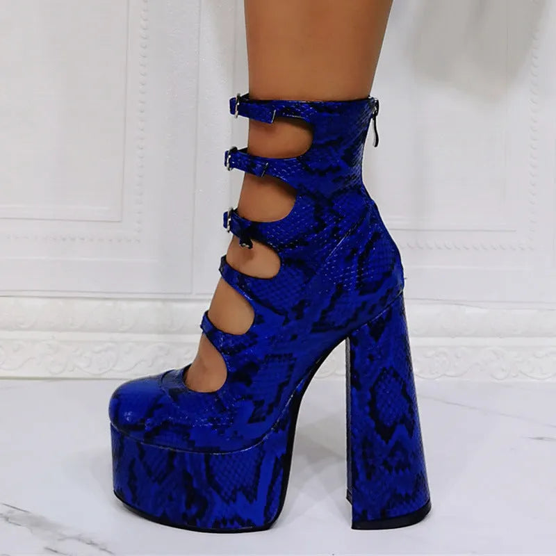 Women's black patent leather platform high heel boots with a serpentine belt and buckle closure.