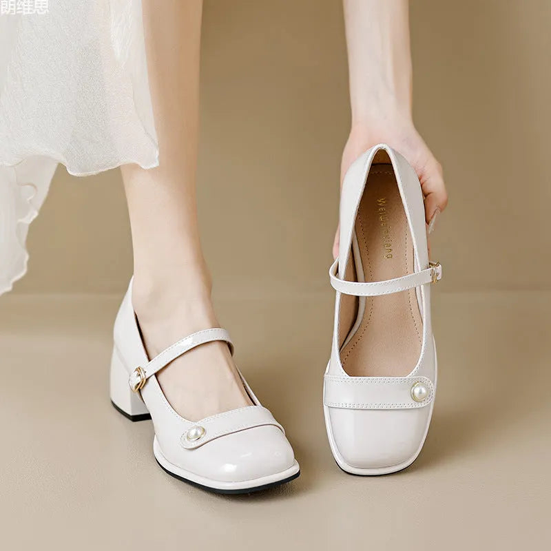 Patent leather chunky heel ankle boots with square toe and buckle fastening in apricot colour