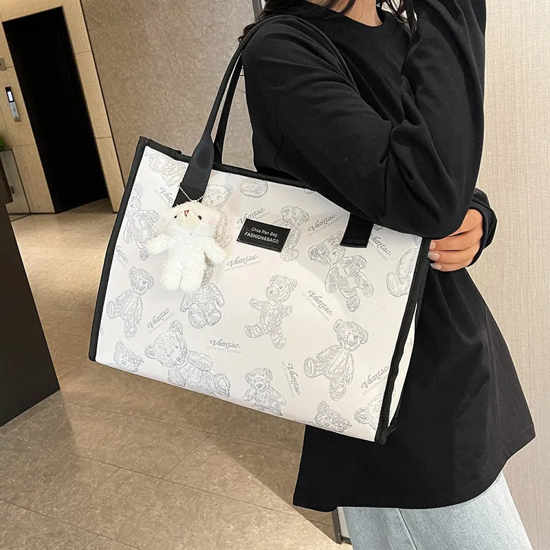 Printed canvas tote bag with rhombus pattern and sandwich pocket design in black colour