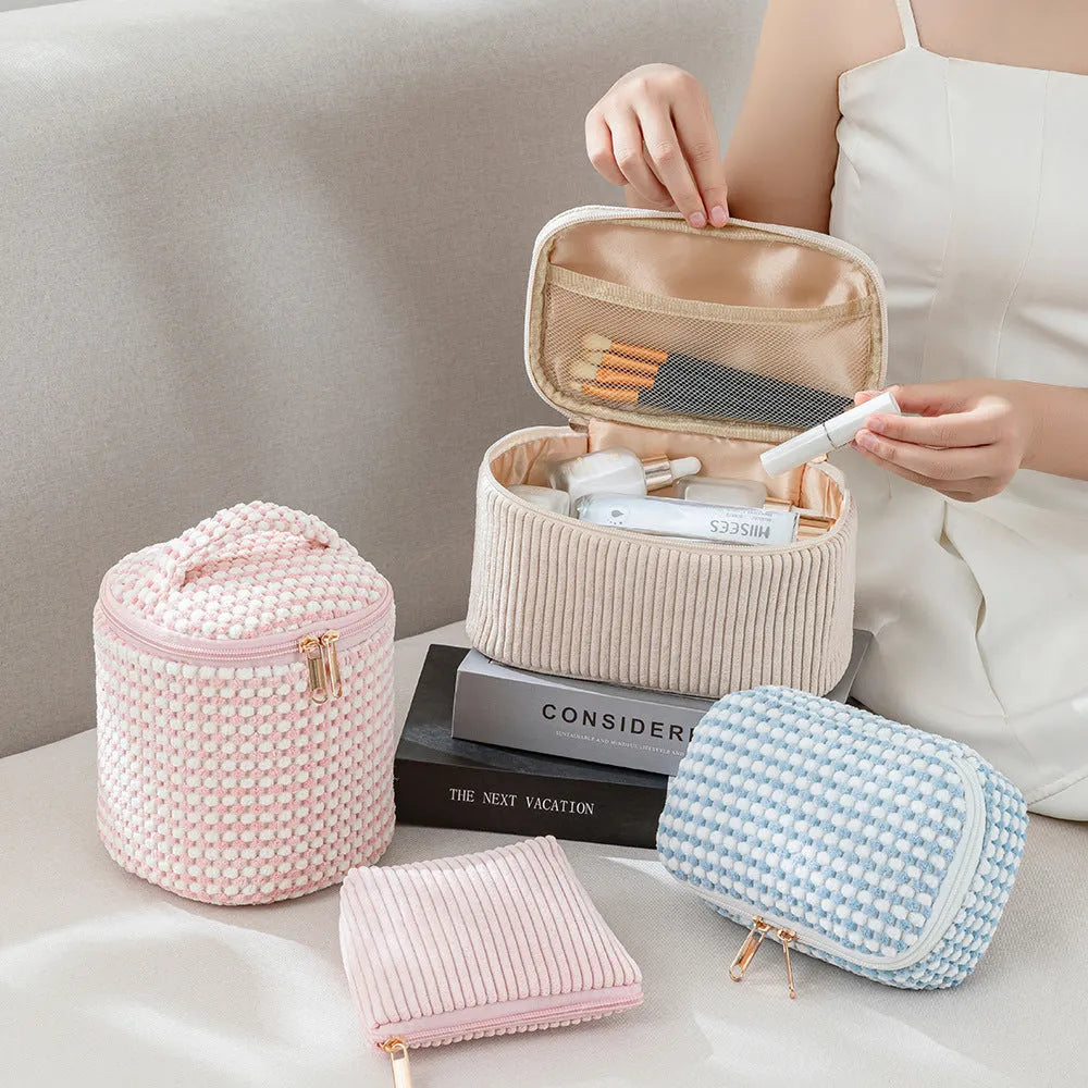 Four cube-style flannelette makeup bags in matching blue with white dots design