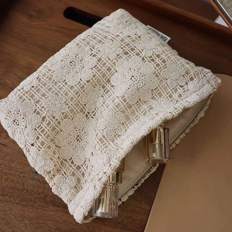 Handmade corduroy cosmetic bag with crocheted hollow flower pattern and ethnic embroidery