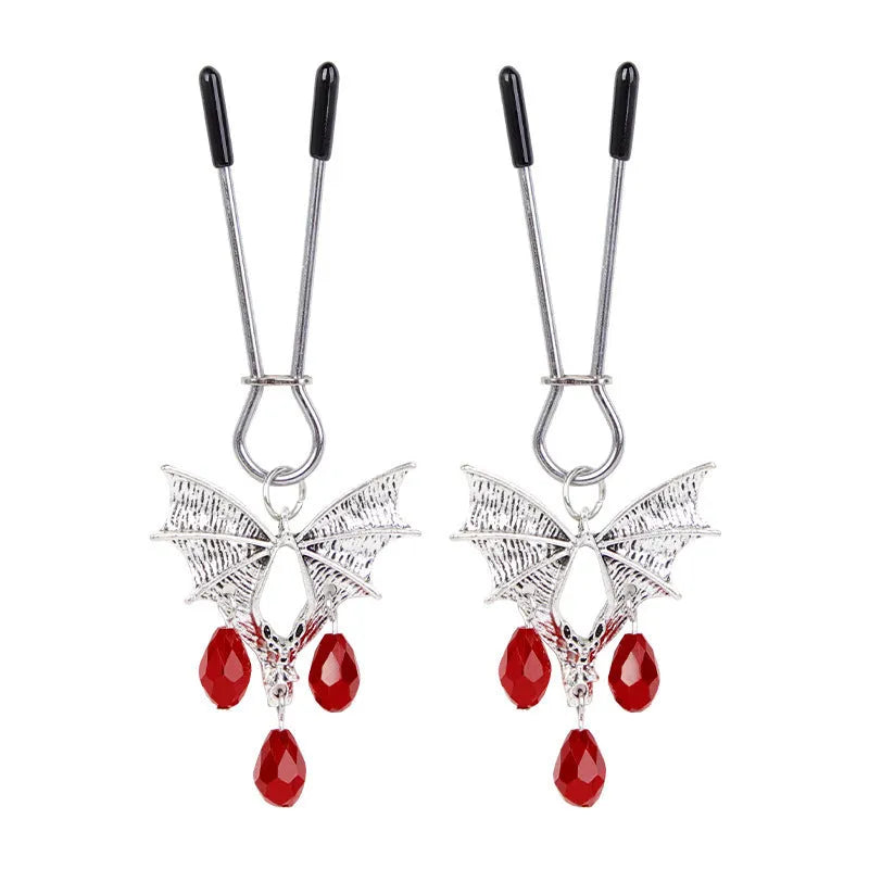 Silver bat-shaped nipple clamps with ruby accents and adjustable pressure mechanism