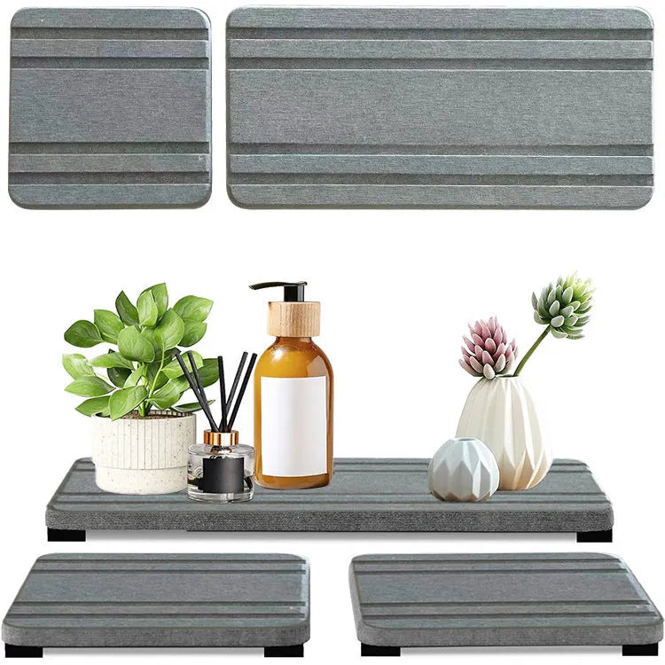 Three square diatom oil bathroom countertop drying mats in solid colours on a bathroom vanity