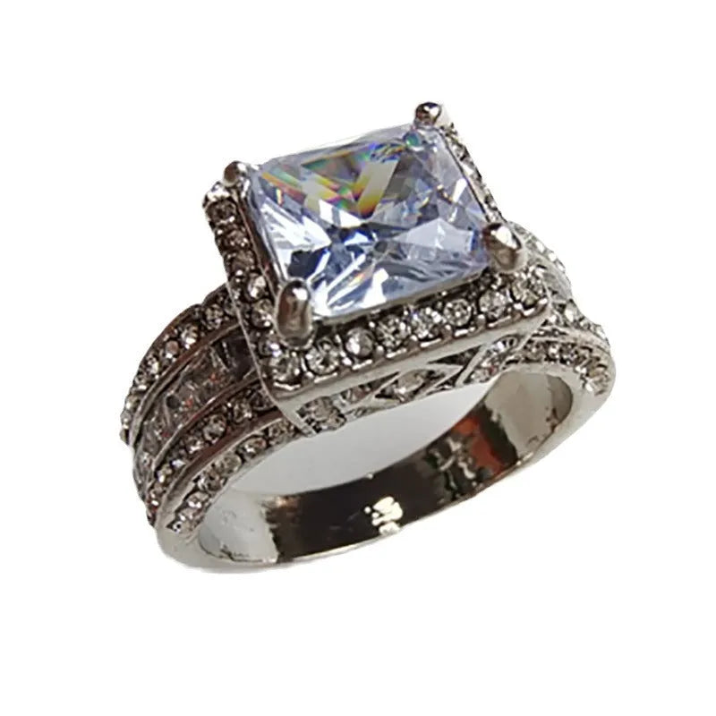 Silver-toned geometric women's ring with round elements in gold or white electroplated finish
