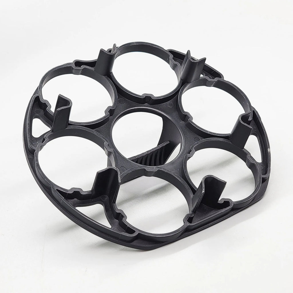 Black plastic egg holder for cooking machines measuring 13.8 by 12.6 by 5.7 cm