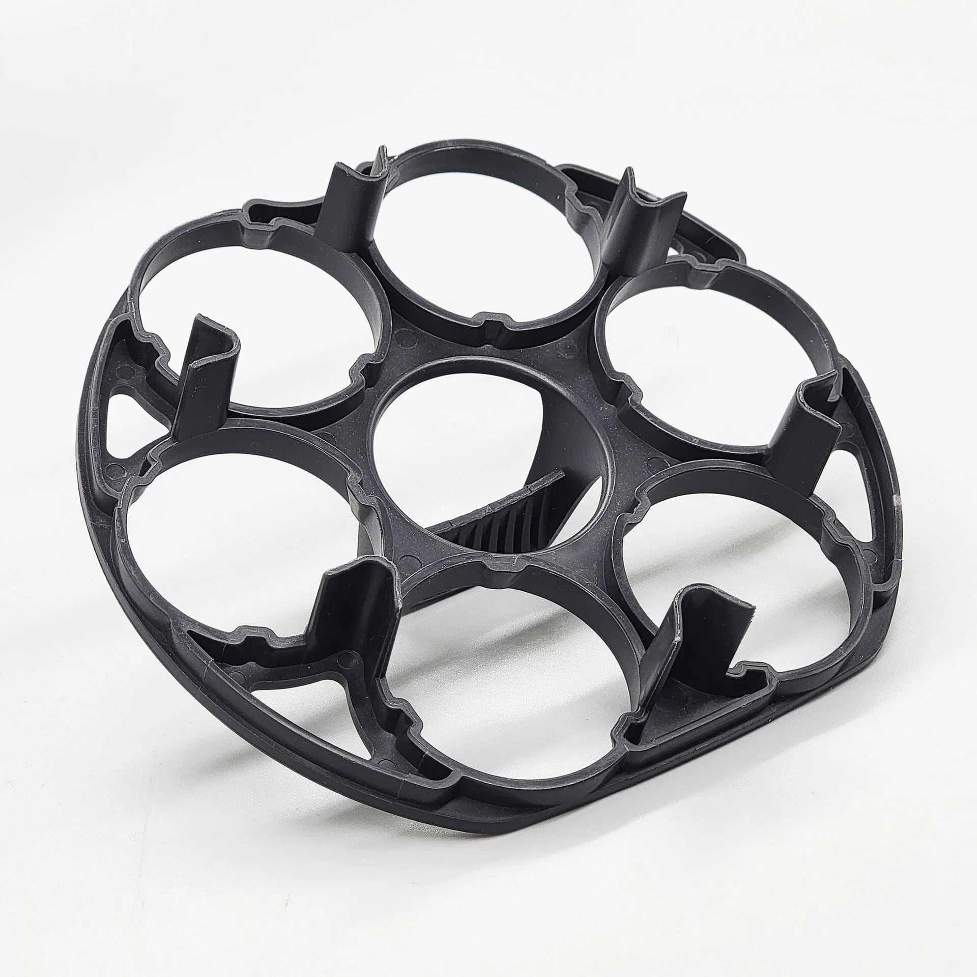 Black plastic egg holder for cooking machines measuring 13.8 by 12.6 by 5.7 cm