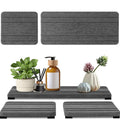 Three square diatom oil bathroom countertop drying mats in solid colours on a bathroom vanity
