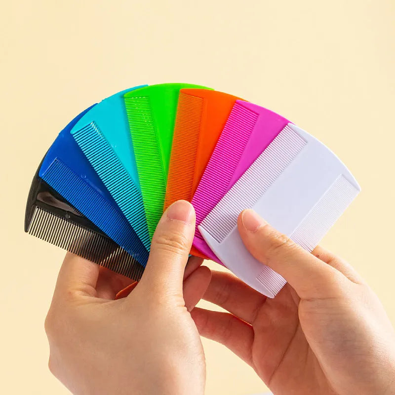 Double-edged plastic fine-toothed flea comb in various colours on a white background.