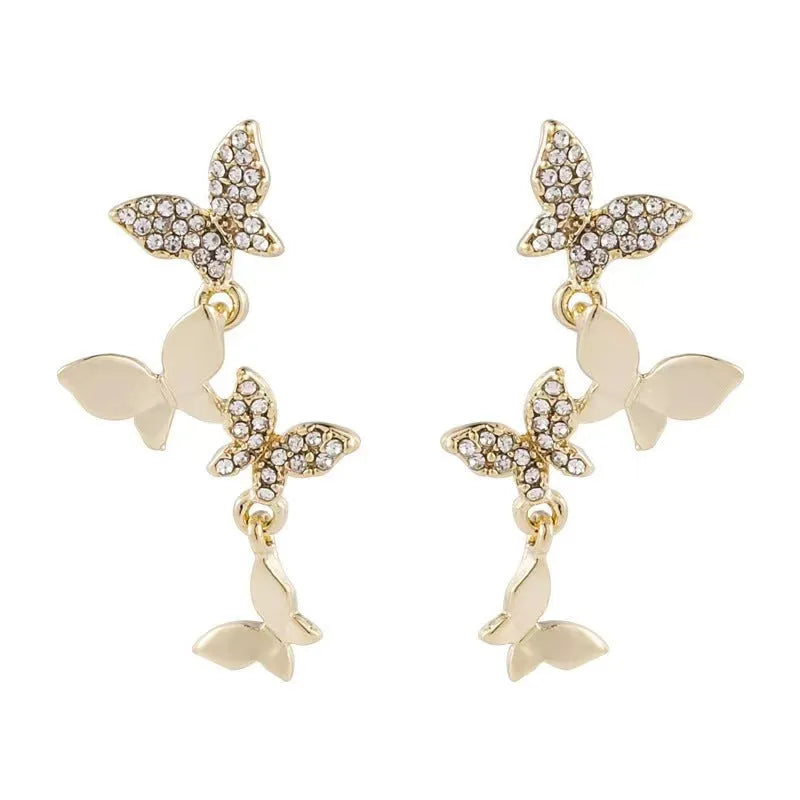 Women's gold tone copper butterfly drop earrings with four butterfly designs