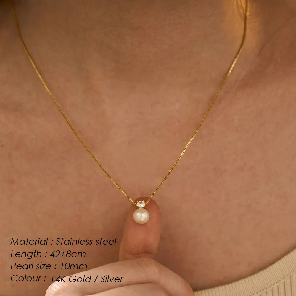 Women's stainless steel necklace with imitation pearl pendant and zircon accents