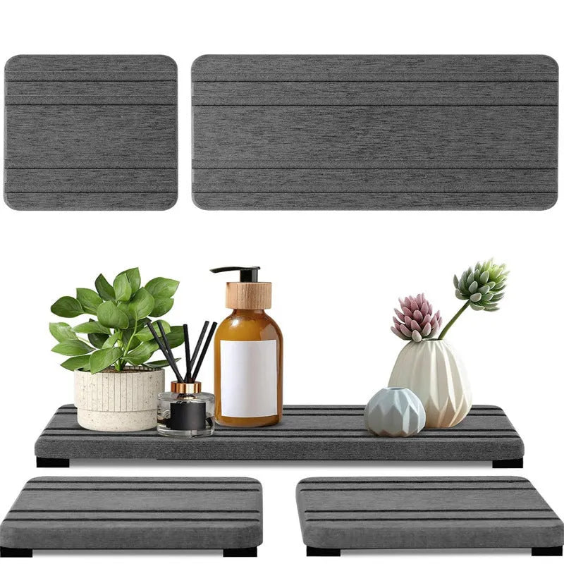 Three square diatom oil bathroom countertop drying mats in solid colours on a bathroom vanity