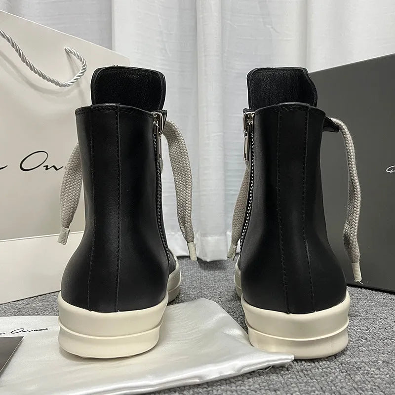 Men's and women's black high-top leather sneakers with a side zipper and round toe on a rubber sole.