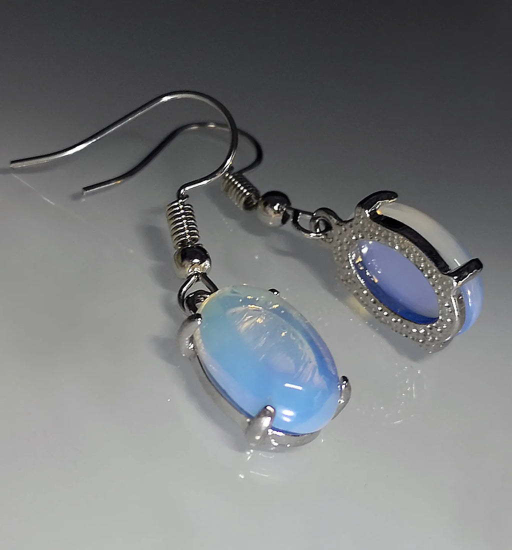 Moonlight opal drop earrings with retro cross design and ellipse detailing