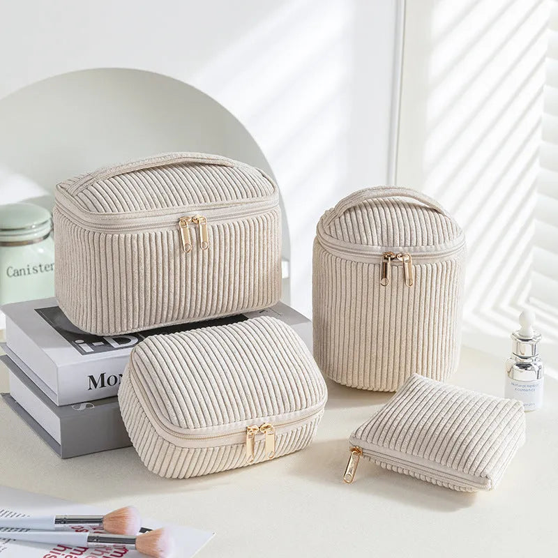 Four cube-style flannelette makeup bags in matching blue with white dots design