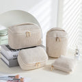 Four cube-style flannelette makeup bags in matching blue with white dots design